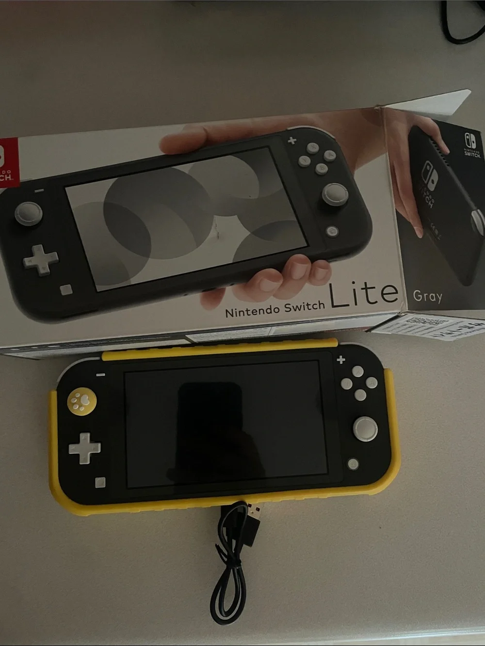 Nintendo Switch Lite Gray with Yellow Case with game